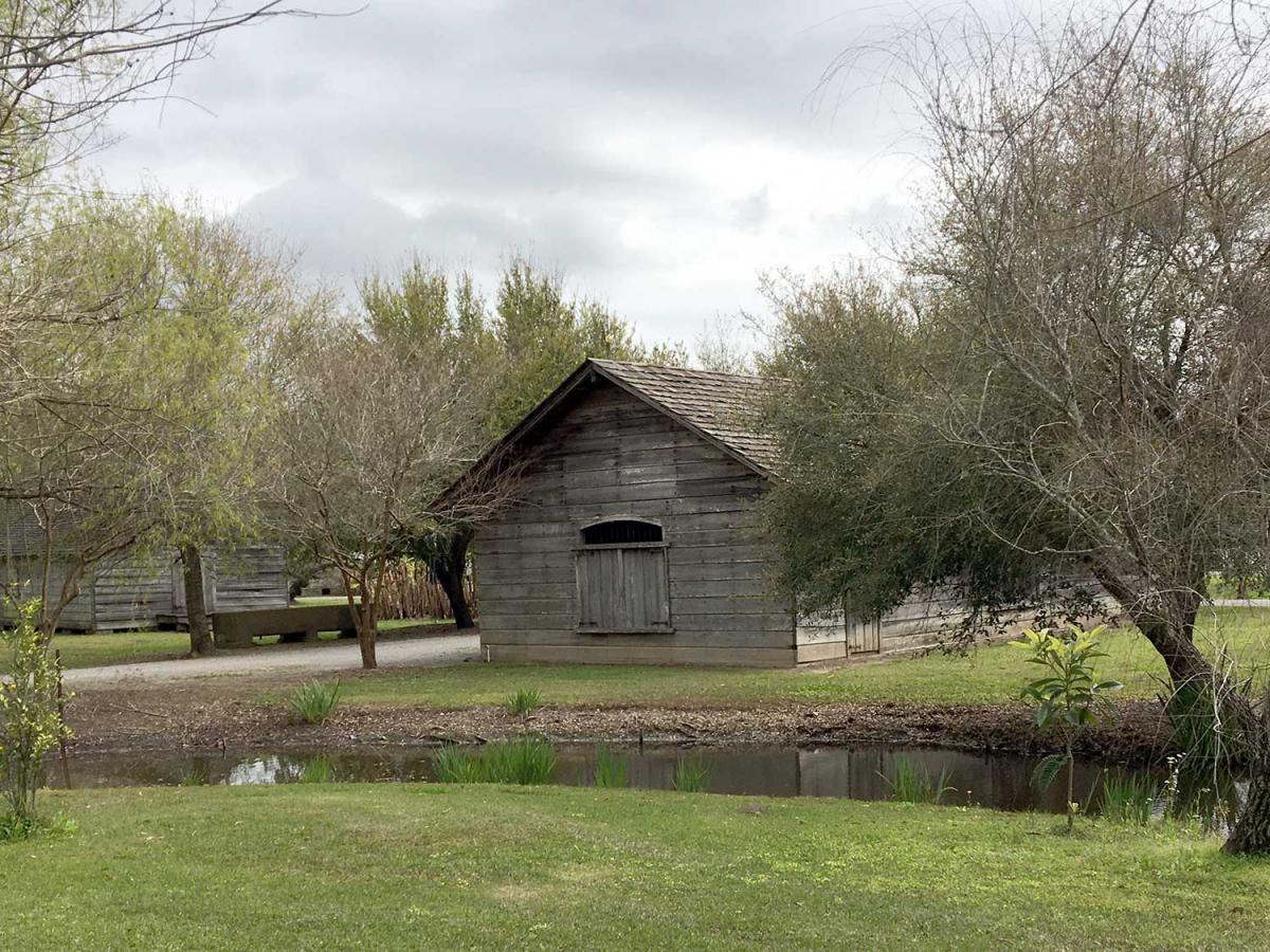 Wooden Building Next To Ditch